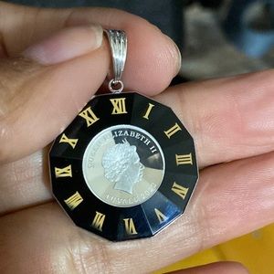 18karat white gold outside and inside 9995 platinum pendant.